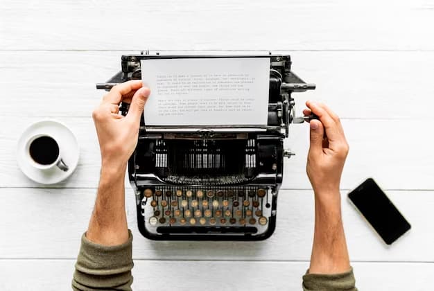 Hand using a typewriter