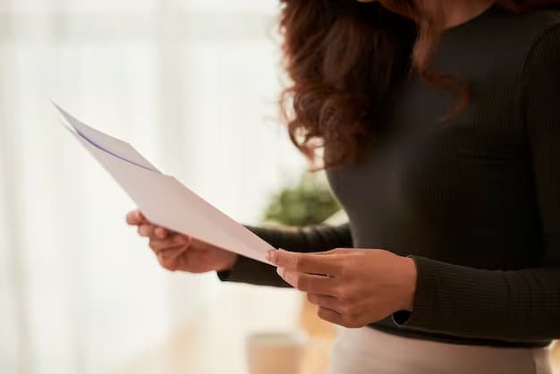 Woman in black attire holding papers