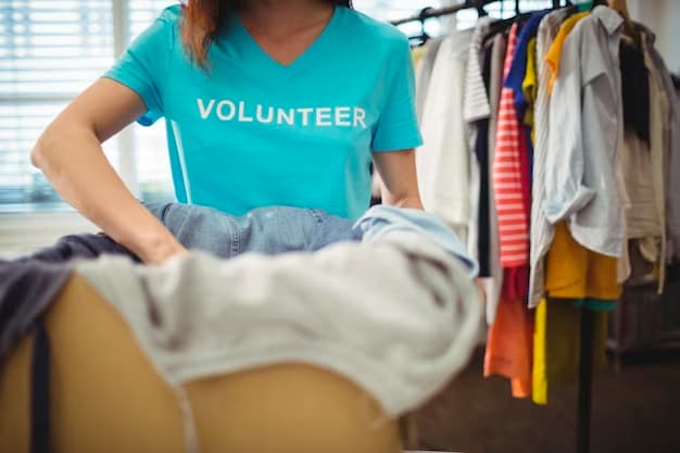 Volunteer placing clothes in a box