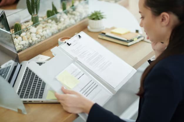 Woman holding a folder with documents and reading